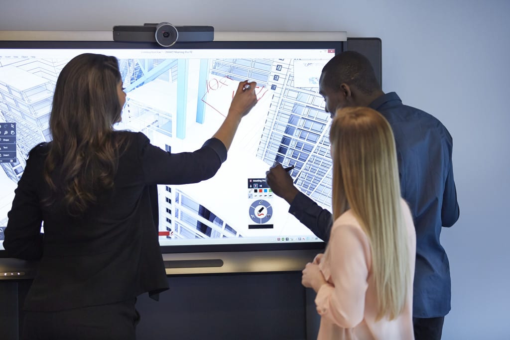 Millennials using a SMART Technology interactive whiteboard